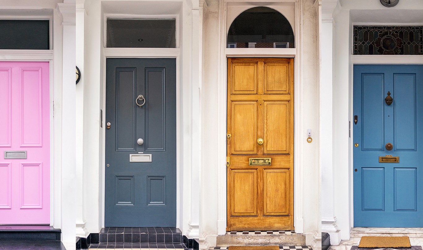 A row of four colorfully-painted doors.